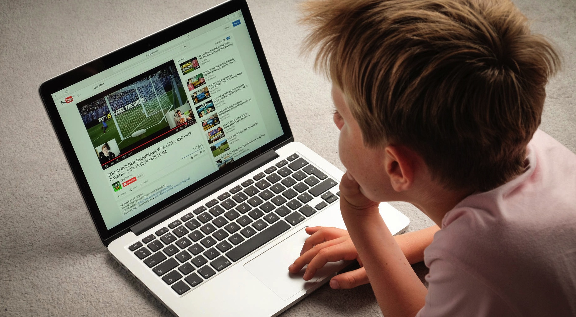 A Child watching Youtube videos on a laptop computer  The Early 