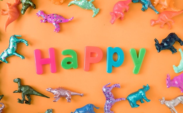 Colorful Animal Toy Figures Background with the Word Happy – Free Download