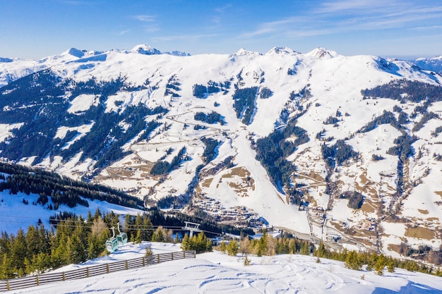 Stunning Aerial View of a Ski Resort and Village in the Alps – Free Download