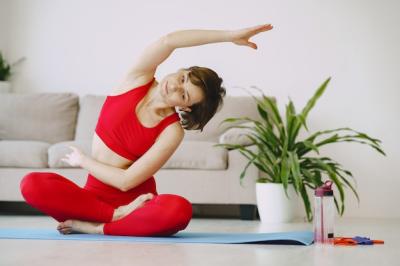 Girl in a Red Sports Uniform Practicing Yoga at Home – Free Download