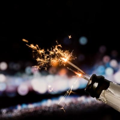 Champagne Bottle with Fire Sparkler on Bokeh Background – Free Download