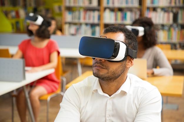 Focused Young Guy with Virtual Reality Headset – Free Stock Photo, Download Free