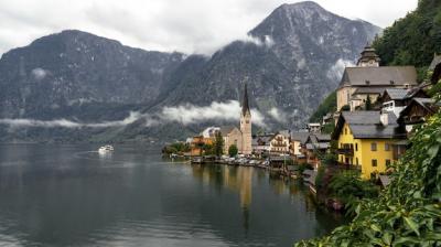 Rainy Day Landscape of Hallstatt in Austria with Water and Rocky Mountains – Free Download