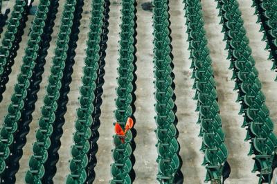 High Angle Shot of Green Plastic Chair Rows with One Orange Chair – Free Download