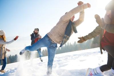 Playful Man with Crew in the Snow – Download Free Stock Photo