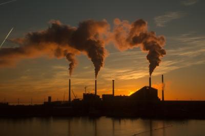 Low Angle View of Factory at Sunset with Smoke and Steam – Free to Download