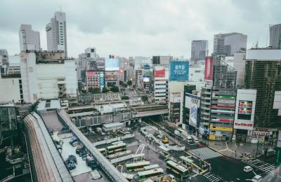 City Bus Terminal Surrounded by Modern Buildings – Free Download