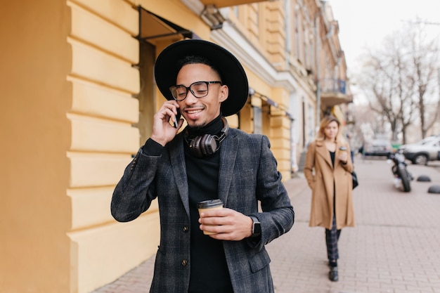 Pleased Young African Man Enjoying Coffee on the Street – Free Stock Photo, Download for Free