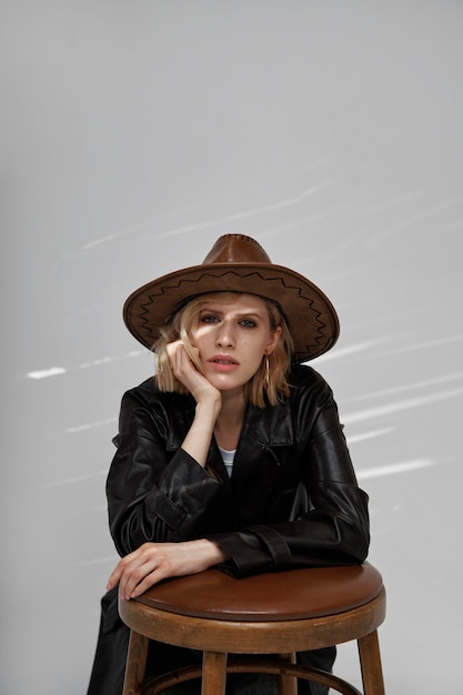 Model Posing with Chair and Hat – Free Stock Photo for Download