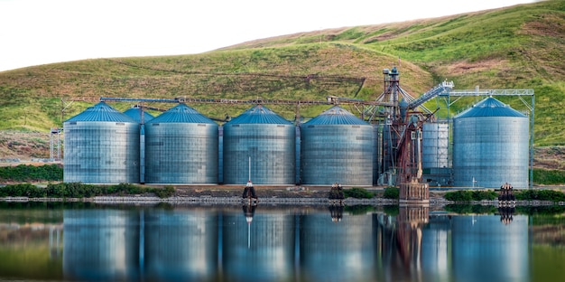 Panoramic View of Industrial Buildings by the Lake with Reflections – Free Stock Photo, Download for Free