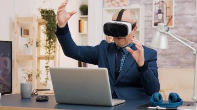 Retired Man Enjoying Virtual Reality in Living Room with Coffee – Free Stock Photo for Download