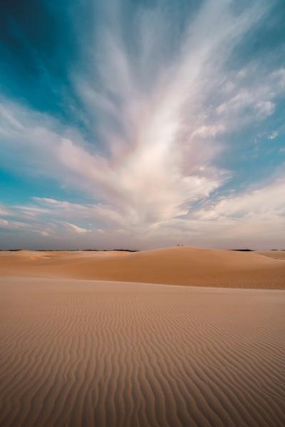 Vertical Shot of Sandy Hills and Beautiful Clouds in the Sky – Free to Download