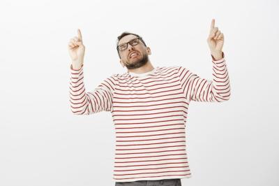 Displeased Adult Man in Fancy Striped Pullover – Free Download Stock Photo