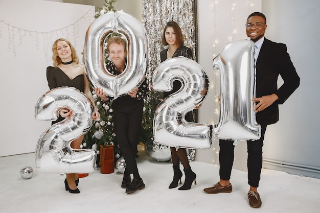 Christmas and New Year Celebrations with People and Balloons – Free Stock Photo for Download