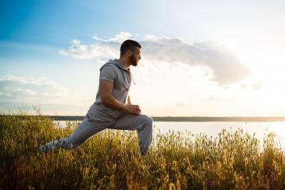 Young Sportive Man Training in Field at Sunrise – Free Stock Photo for Download