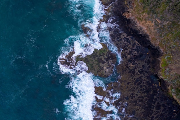 Aerial View of Waves Crashing on Rocks – Free Download Free Stock Photo