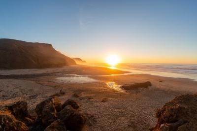 Stunning Sunset Over Mountainous Shore and Sea | Free Download
