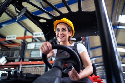 Professional Female Industrial Driver Operating Forklift in Warehouse – Free Download