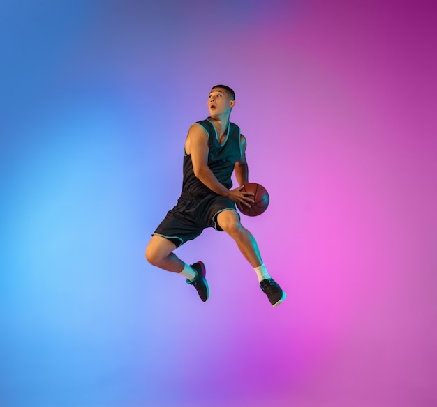 Young Basketball Player in Motion on Gradient Studio Background with Neon Light – Free Stock Photo for Download