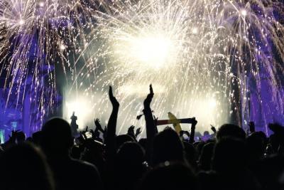 Silhouette of Festival-Goers Against Night Fireworks | Free Stock Photo Download