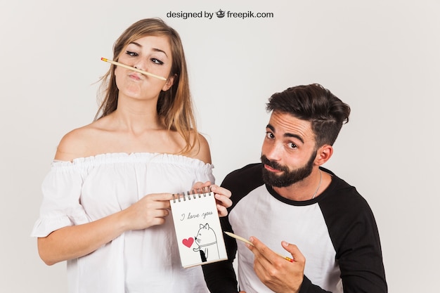 Couple Presenting Notepad – Free Stock Photo, Download Free