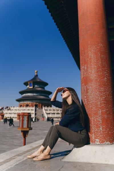 Brunette Girl Sitting on Temple Steps in China – Free Download