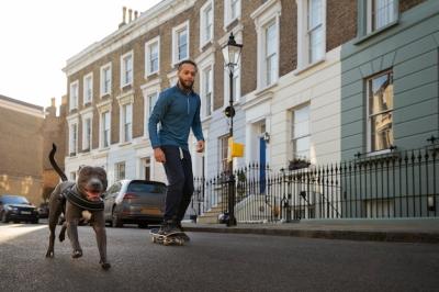 Man with Skateboard and Dog – Free to Download