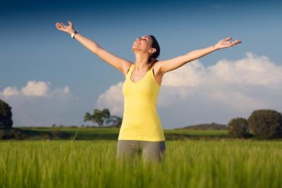 Springtime Bliss: Beautiful Young Woman in a Cereal Field – Free Download