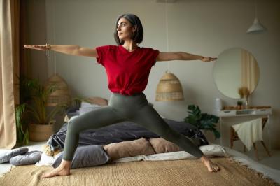 Stylish Young Woman Practicing Vinyasa Flow Yoga in Her Bedroom – Free Download