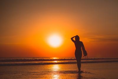 Girl Posing with a Board at Sunset – Free Stock Photo, Download for Free