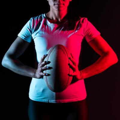 Athletic Female Rugby Player Holding Ball – Free Download