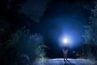 Long Shot of a Man with a Headlight – Free Download