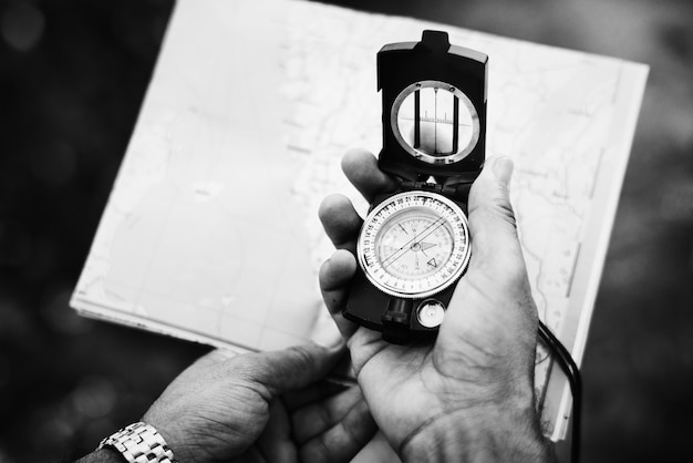 Man Checking Direction on a Compass – Free Stock Photo, Download Free