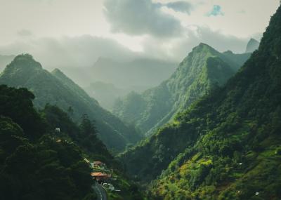 Mesmerizing Green Mountains Under a Cloudy Sky – Free Download