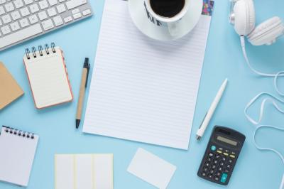 Coffee Cup and Notepad Arrangement on Blue Background – Free Stock Photo for Download