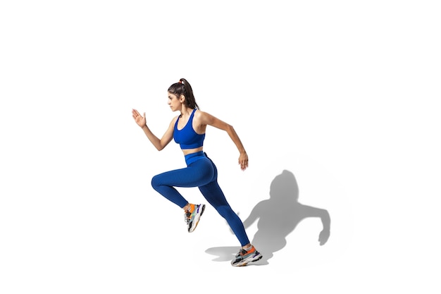 Portrait of a Beautiful Young Female Athlete in Motion – Free Download