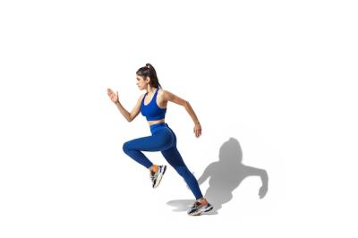 Portrait of a Beautiful Young Female Athlete in Motion – Free Download