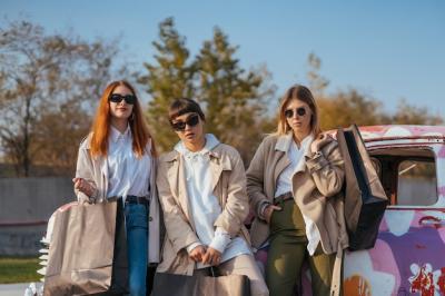 Young Happy Women with Shopping Bags by a Vintage Car – Free Stock Photo for Download