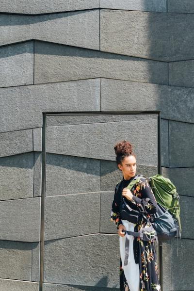 Stylish Woman Carrying Backpack Outdoors – Free Stock Photo for Download