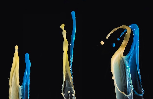 Blue and Yellow Waterdrops Isolated on Dark Backdrop – Free Download