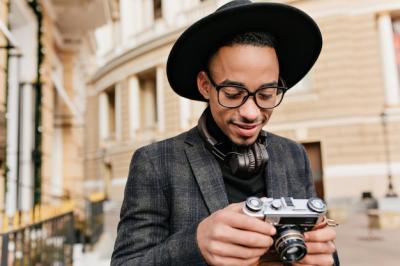 Cheerful African Young Man in Checkered Jacket – Outdoor Photography