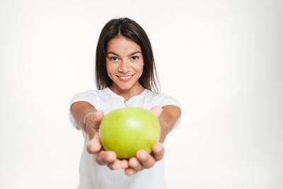 Smiling Healthy Woman with Green Apple – Free Download