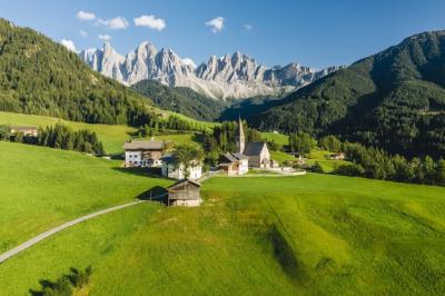 High Angle Shot of Buildings Surrounded by Rocky Mountains in Funes Valley – Free Stock Photo, Download for Free