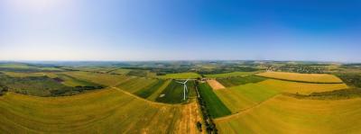 Aerial Drone Panorama View of Working Wind Turbine in Moldova – Free to Download