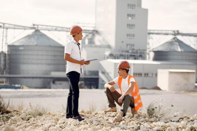 Engineers in Helmets Standing by the Factory – Free Stock Photo, Download Free