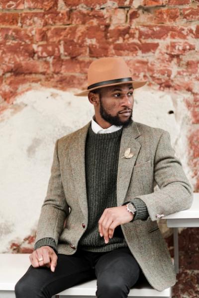 Handsome Man Posing with Brick Wall Background – Free Download