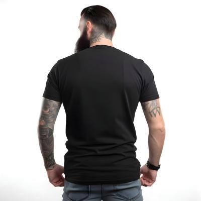 Tattooed Man in Black T-Shirt on White Background – Free Download