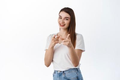 Smiling Assertive Woman Pointing at Front – Invitation to Work or Praise – Free Download