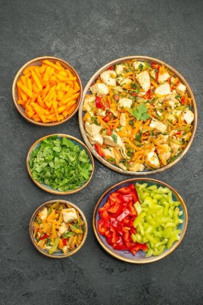 Top View Chicken Salad with Vegetables on Dark Grey Floor – Free Download