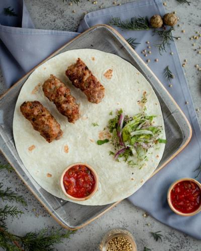 Azerbaijani Lule Kebab with Green Salad and Red Sauce in Lavash – Free Stock Photo Download